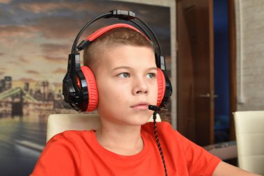 boy is playing an online game on the internet. children's gambling addiction. online learning