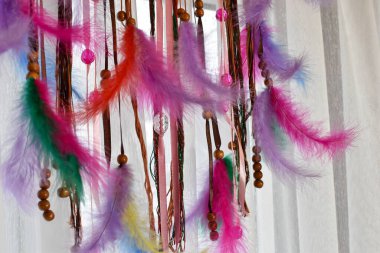 colored handmade dreamcatcher. traditional amulet of the ancient Indians from evil spirits. braided amulet with feathers