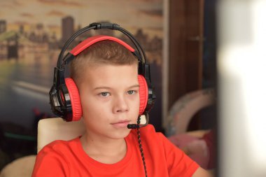 boy is playing an online game on the internet. children's gambling addiction. online learning