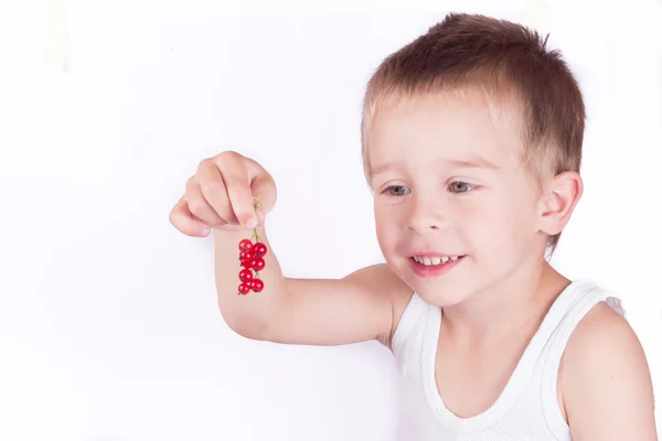 Little boy with berries — Stock Photo, Image