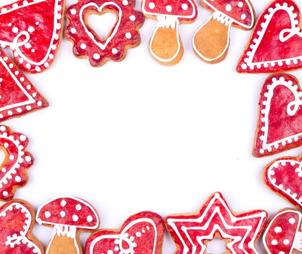 Gingerbread cookies and spices over white background close up — Stock Photo, Image