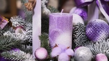 Christmas decorations, pink and white candle, balls, decorative Christmas tree with snow rotate in a circle. New Year Video Background.