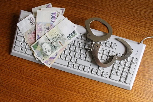 Handcuffs is on the PC keyboard. — Stock Photo, Image