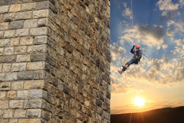 Policeman on a rope in the sunset — Stock Photo, Image