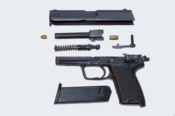 Afmonteret pistol, isoleret i hvidt - Stock-foto