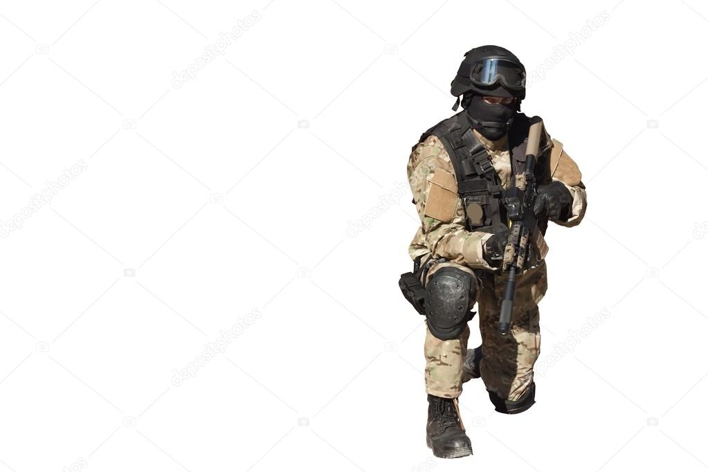 Special Forces soldier, with assault rifle, isolated on white