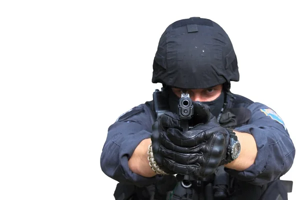 Swat police officer pointing a gun at the camera, close-up, isolated on white — Stock Photo, Image