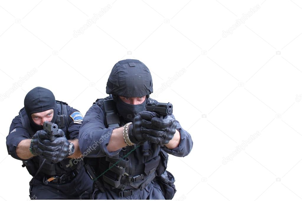 Swat police officer pointing a gun at the camera, close-up, isolated on white
