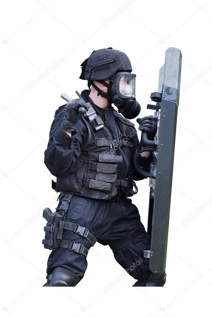 Policeman in a gas mask and shield, isolated on white
