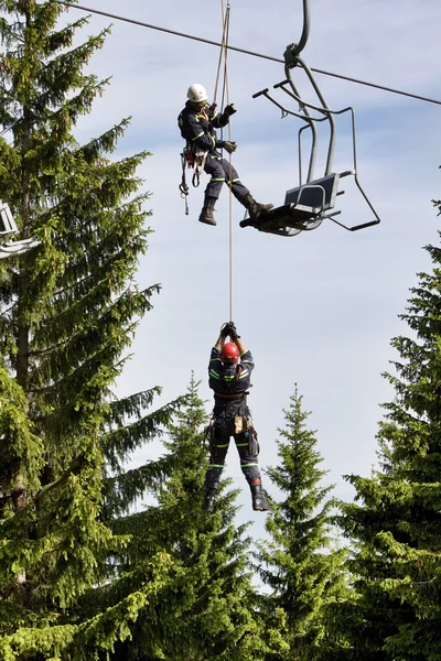 Training of rescue teams on a chairlift at ski resort — Stock Photo, Image