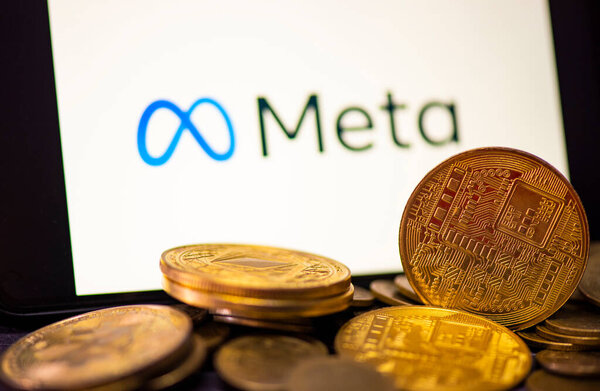 Metaverse coin crypto currency blockchain concept, META on smartphone screen with gold coin on meta logo background. New facebook company logo meta metaverse. Bangkok Thailand, December 2, 2021