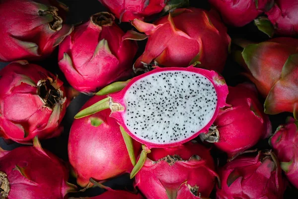 dragon fruit cut half on pitahaya background , fresh dragon fruit tropical in the asian thailand healthy fruit concept -top view