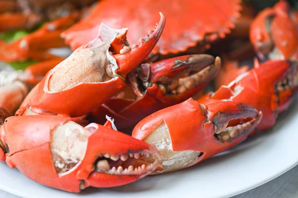 claw crab cooking food seafood plate, fresh crab on white plate boiled or steamed crab red in the restaurant food