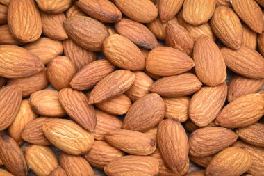 Almonds nuts on background, Close up delicious sweet almonds top view, roasted almond nut for healthy food and snack