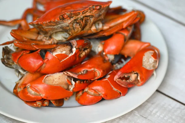 claw crab cooking food seafood plate, fresh crab on white plate boiled or steamed crab red in the restaurant