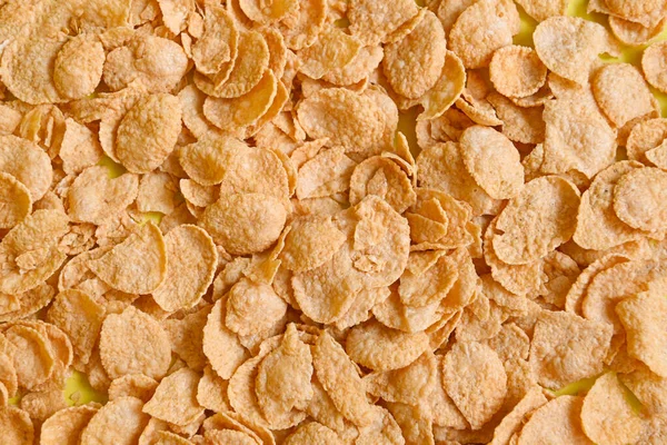 Cornflakes background texture top view, cornflakes breakfast food and snack for healthy food concept, morning breakfast fresh whole grain cereal