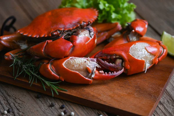 claw crab, fresh crab on wooden cutting board seafood crab cooking food boiled or steamed crab red in the seafood restaurant kitchen