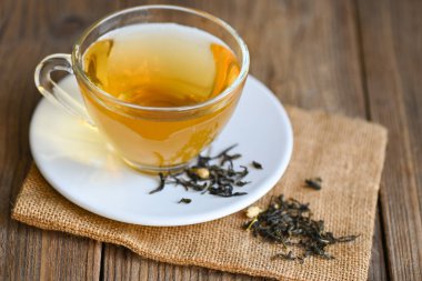 tea herbal on tea cup with chinese dry tea on wooden table  