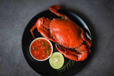 crab seafood plate with, fresh crab on black plate, crab cooking food boiled or steamed crab red in the restaurant 