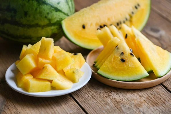 Yellow watermelon slice on plate, Closeup pile of sweet watermelon slices pieces fresh watermelon tropical summer fruit