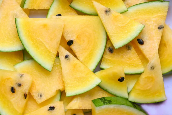 Yellow Watermelon Slice Background Closeup Pile Sweet Watermelon Slices Pieces — Stock Fotó