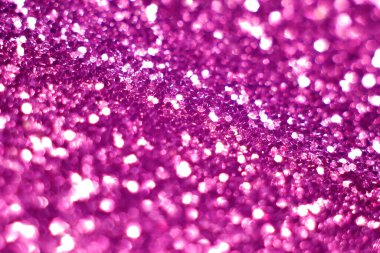 Pembe parıltı, bulanık efekt. Fuchsia rengi. Parlak tatil ışık çemberleri, kamera ve lenslerdeki Bokeh 'ten meydana gelir. Tasarım için arka plan. Noel arkaplanı.