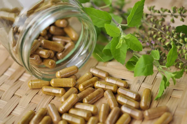 Herb capsule — Stock Photo, Image