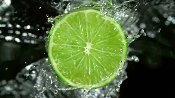 Super Slow Motion Shot Rotating Fresh Orange Slice Splashing Water — Stock Video