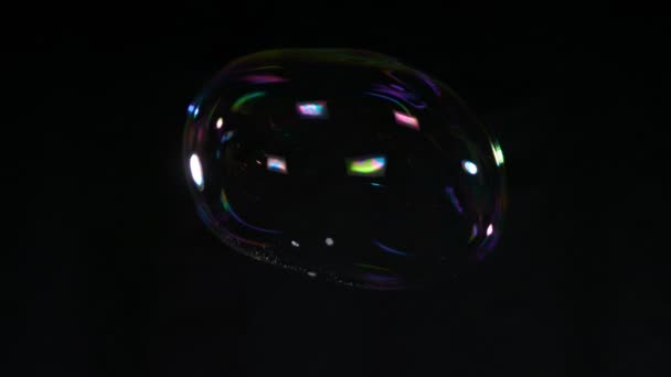 Super Slow Motion Shot Flying Colorful Soap Bubble Isolated Black — стокове відео