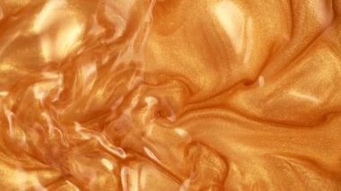 Altın Işıldayan Sıvı Arkaplan Süper Yavaş Film Çekimi, 1000fps. 4K Çözünürlükte Yüksek Hız Sinema Kamerası ile Çekim.