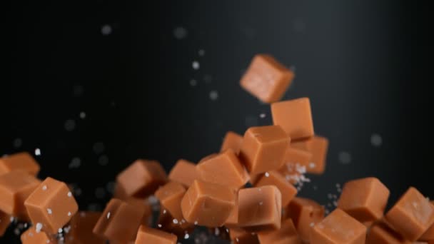 Super Slow Motion Shot Salted Caramel Explosion Auf Dunkelgrauem Hintergrund — Stockvideo