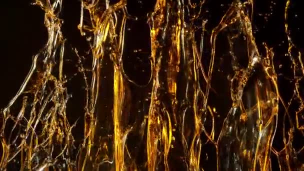 Super Slow Motion Shot Splashing Golden Oil Black Background Pada — Stok Video