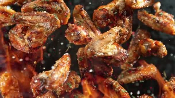 Super Slow Motion Shot Grilled Spicy Chicken Wings Flying Camera — Stock Video