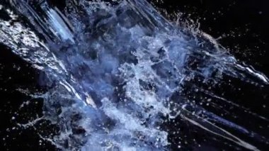 Super Slow Motion shot of Splashing Water on Black background on 1000 fps. 4K 'da yüksek hızlı sinema kamerası ile çekildi...