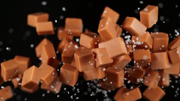 Super Slow Motion Shot Solted Caramel Explosion Izolowane Czarnym Tle — Wideo stockowe