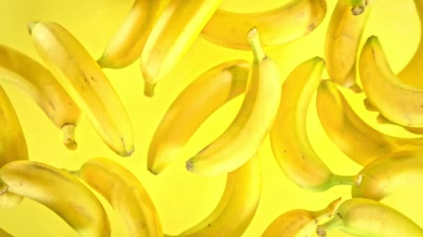 Super Slow Motion Shot Fresh Bananas Yellow Background Flying Camera — Stock Video