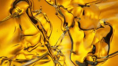 Su Sıçratan Altın Yağ Dalgaları 'nın Süper Yavaş Çekimi. 4K 'da Yüksek Hız Sinema Kamerası ile çekildi..