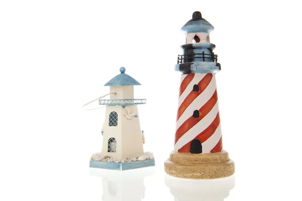 Two lighthouses in closeup and isolated in white — Stock Photo, Image