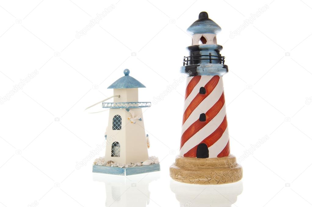 Two lighthouses in closeup and isolated in white