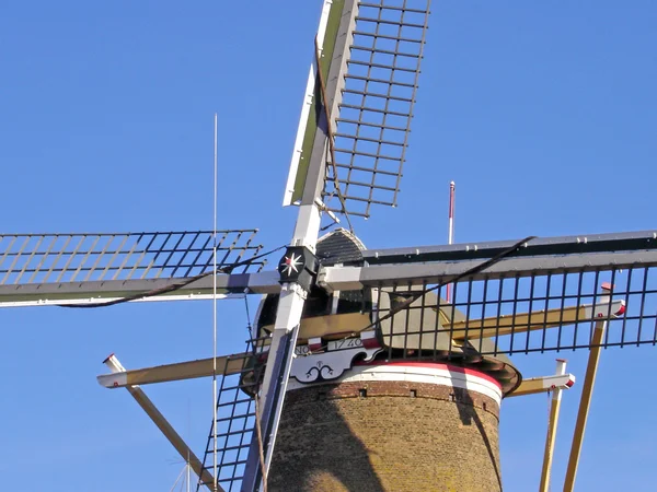 Windmill cross with stacked sails — Stock Photo, Image