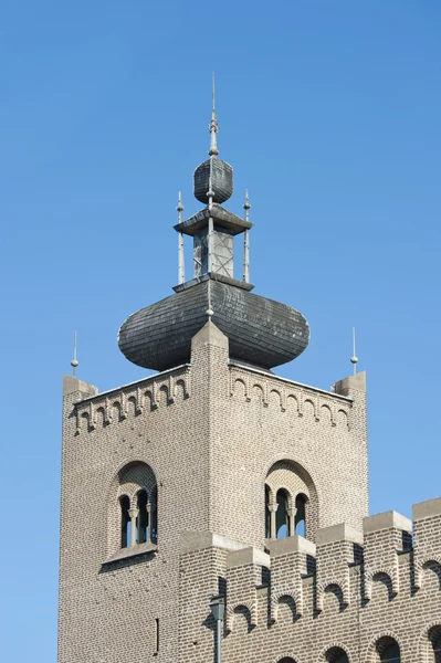 Decorated monastery tower with battlements — Stock Photo, Image
