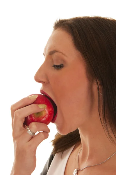 Girl bites in red apple — Stock Photo, Image