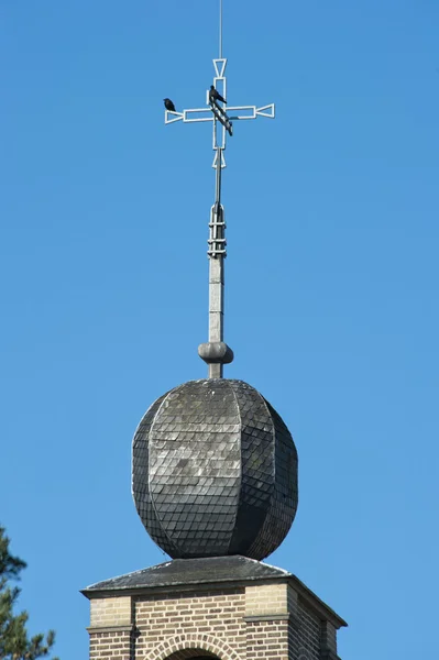 Decorated monastery tower with cross — Stock Photo, Image