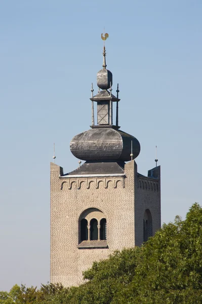 Monastery tower behind tree tops — Stock Photo, Image