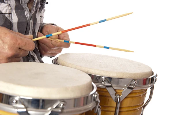 Man playing bongo with sticks — Stock Photo, Image