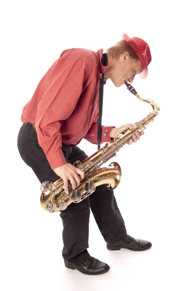 L'uomo che suona il sax tenore si piega — Foto Stock