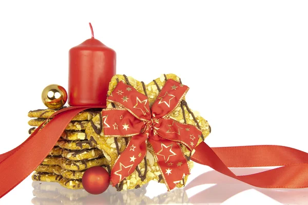 Cukroví vánoční stuha koule svíčkou — Stock fotografie
