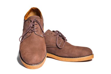 Pair of mens brown suede shoes isolated on white background