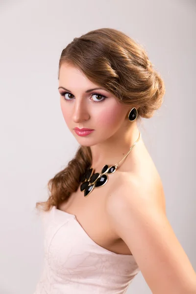 Young girl with makeup and beautiful big earrings — Stock Photo, Image