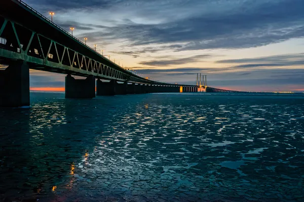 The Øresund Bridge reflected in icy waters — 스톡 사진